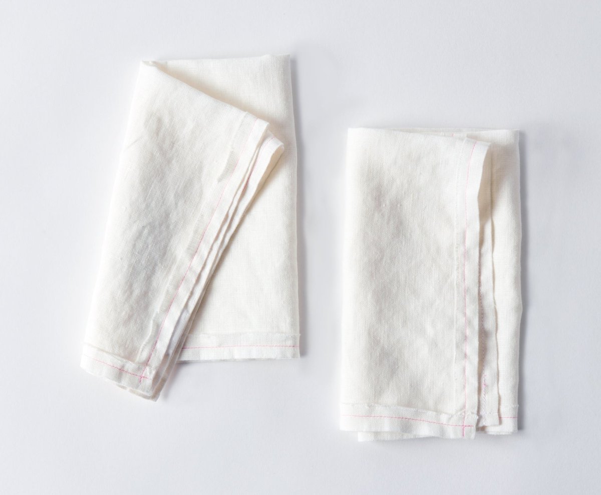 White linen napkins made in the USA with pink stitching. – celina mancurti