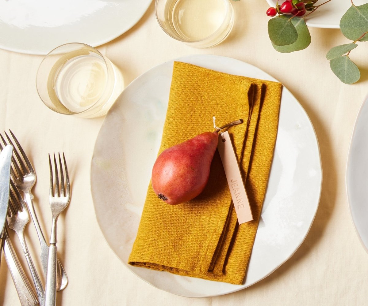 https://www.celinamancurti.com/cdn/shop/files/Mustard-Linen-Napkin-Set-of-2-napkins-2.jpg?v=1692379751&width=1445